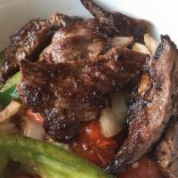 Steak Fajita Bowl · Grilled strips of beef, green peppers, onions, tomatoes, rice tossed in a bowl. Served with ...