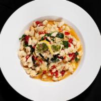 Crabby Delight · Jumbo lump crab meat sautéed with spinach and sundried tomatoes over angel hair pasta in you...