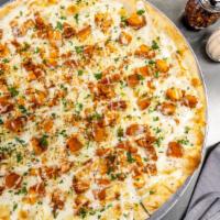 Buffalo Chicken · Buffalo chicken with ranch and a touch of chopped parsley.