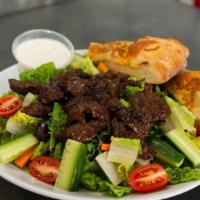 Steak Tip · Sirloin steak tips on garden salad.