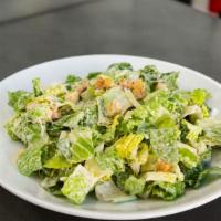 Caesar · Lettuce, shredded parmesan, croutons, & Caesar dressing.