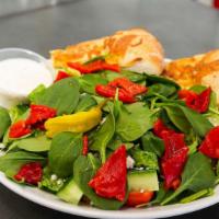 Mediterranean · Garden salad mixed with greens, fresh mozzarella, and roasted red pepper.