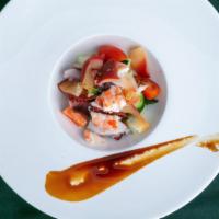 Seafood Ceviche · Mix shrimp, octopus, crab stick, cucumber, tomato, surf clam with spicy lemon garlic sauce.