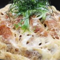 Pork Katsudon · Lightly breaded pork cutlet, egg, caramelized onions, and scallions served with sweet soy da...