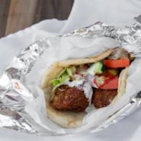 Falafel Gyro Wrap(Free Drink) · Lettuce tomato onion cucumber white sauce and hot sauce