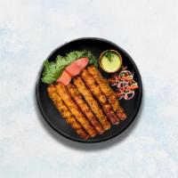 Chicken Seekh Kebab · Minced chicken seasoned with traditional Indian herbs, rolled onto skewers and cooked over f...