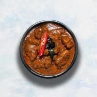 Goat Curry · Tender goat morsels braised in a hot gravy made with our traditional curry powder.