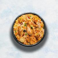 Chicken Biryani · Long grain basmati rice cooked with tender chicken and aromatic Indian herbs. Served with ra...
