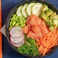 Spicy Salmon Pokebowl · Salmon, avocado, seaweed salad, radish, ginger carrots, edamame pods, cucumber, and sesame s...