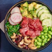Ahi Tuna Pokebowl · Diced tuna, cucumber, avocado, radish, seaweed salad, edamame pods, and mixed cranberry, nut...