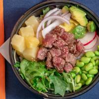 Steak Pokebowl · Steak, raw onions, cucumber, avocado, edamame pods, radish and spring mix, and pineapple chu...