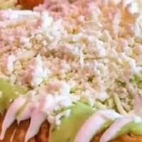 Molotes · Fried dough with choice of stuffing topped with lettuce, fresh cheese, and Mexican crema.