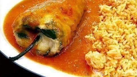 Chiles Rellenos · Stuffed poblano pepper with cheese topped with a red sauce. Served with rice, beans and tortillas.