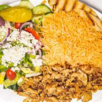 Gyro Plate · Grilled gyro over rice and grilled pita bread with a side of tzatziki sauce and salad.