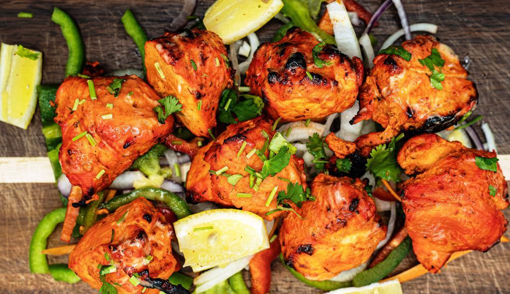 Chicken Tikka · Boneless chicken marinated in spices and baked in Tandoor (clay oven)