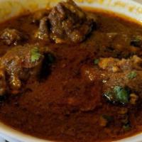 Nepalese Style Goat Curry · Tender bone in goat sautéed in ginger and garlic, marinated in himalayan spices, cooked well...