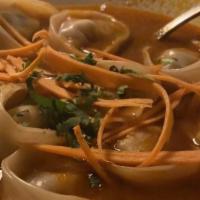 Jhol (Soup) Mo:Mo [No Gluten-Free] · Veg, Chicken or Pork dumpling steamed and dipped into sesame, tomato based mixed soup. 

(Sp...
