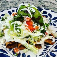 Crispy Taquitos  · (4)  Crispy chicken taquitos topped with lettuce, tomato, onion, tomato,  sour cream, fresh ...
