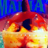 Mangonada · Frozen beverage made of  tropical mango puree. Fresh mango chunks, Tajin, Chamoy and tamarin...