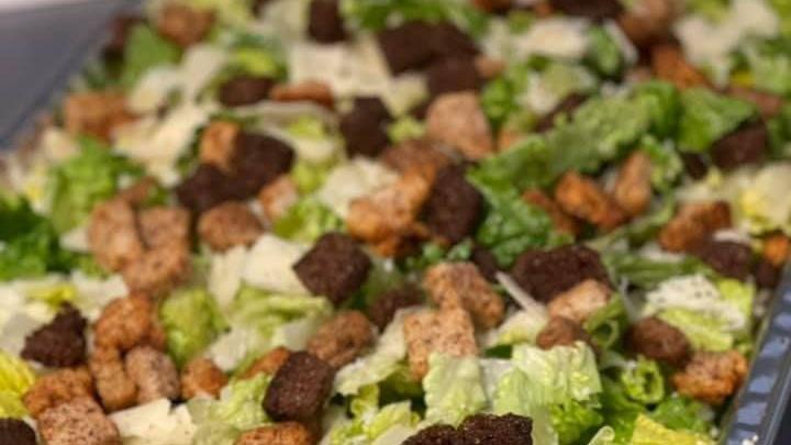 Caesar Salad · romaine lettuce, shaved parmesan, and garlic croutons