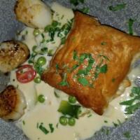 Escargots In Puff Pastry · Tomato, creamy garlic, and herb sauce.