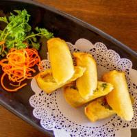 Vegetable Spring Roll Appetizer · Two pieces crisp and crunchy vegetarian spring roll in thai sweet chili sauce.