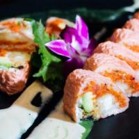 Pink Lady Roll · Shrimp tempura, spicy tuna, eel, and avocado rolled inside soy paper with special sauce.