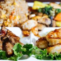 Steak & Shrimp Hibachi · Served with clear soup, garden salad, two shrimp appetizer, assorted vegetables, and fried r...