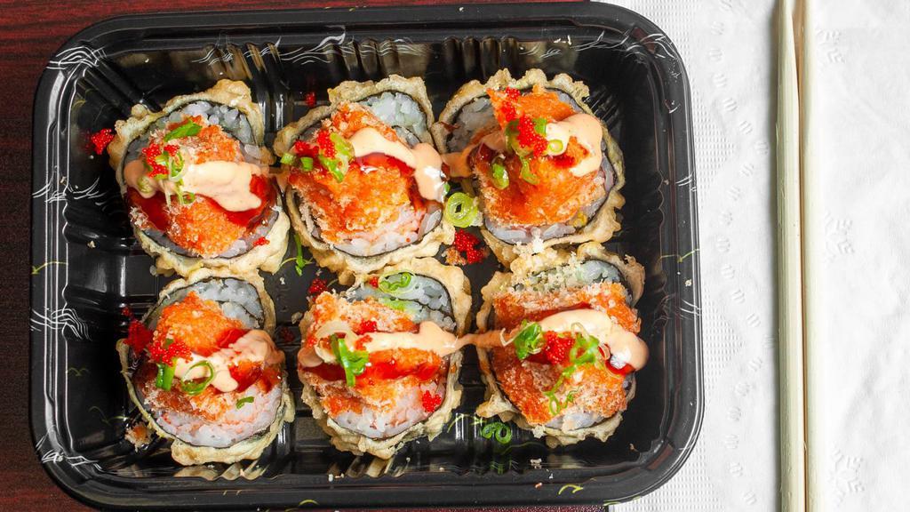 Volcano Roll · Tempura fried crab avocado roll, topped with spicy tuna, spicy mayo, eel sauce and tobiko.