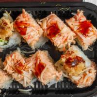 Sakura Roll · Shrimp tempura and cucumber inside, topped with spicy crab, tempura flake and eel sauce.