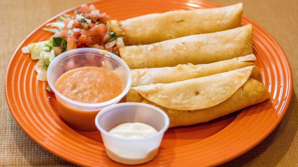 Flautas De Pollo · Four rolled crispy corn tortillas filled with chicken and cheese. Topped with lettuce, pico de gallo and salsa.