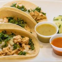 Pollo A La Plancha Taco · Grilled chicken. Served on handmade soft corn tortillas, topped with cilantro, onions, lemon...