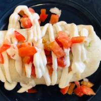 Veggie Burrito · Large flour tortilla filled with rice, re-fried beans, cheese and topped with sour cream and...