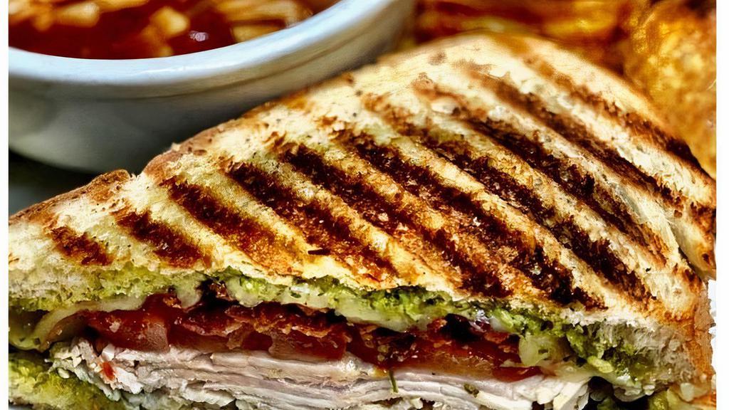 Turkey Bacon Pesto · HAND-CARVED TURKEY, SMOKY BACON, VINE-RIPENED TOMATO, PEPPER JACK CHEESE AND PESTO SERVED ON YOUR CHOICE OF BREAD.