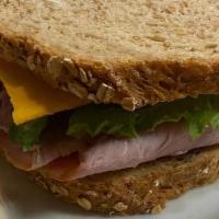 Classic Ham & Cheese · BLACK FOREST HAM, CHEDDAR CHEESE, MAYO, DIJON MUSTARD, TOMATO, AND ROMAINE LETTUCE ON YOUR C...
