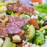 Greek Salad · CRISP ROMAINE LETTUCE, CUCUMBERS, TOMATO, MIXED PEPPERS, KALAMATA OLIVES, FETA CHEESE, AND H...