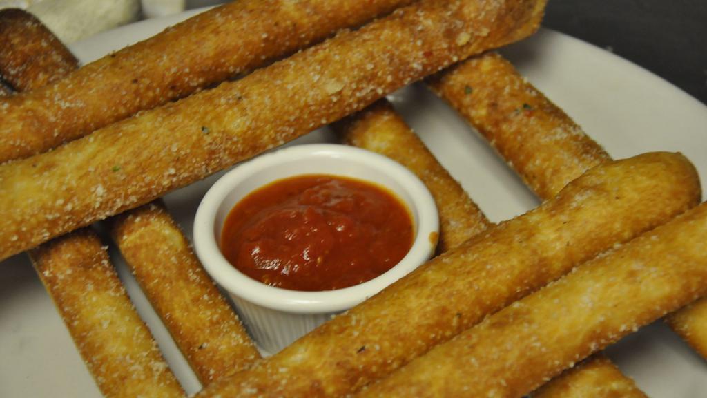 Breadsticks · Brushed with garlic sauce, topped with parm cheese and served with marinara sauce.