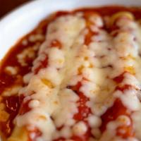 Cheese Manicotti · Pasta stuffed with ricotta & mozzarella cheese, baked in marinara sauce and topped with more...