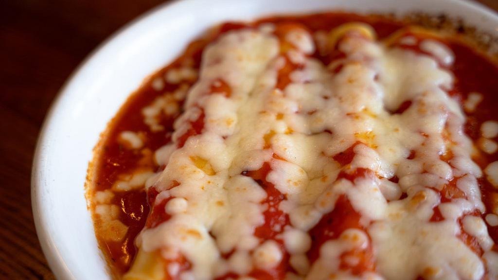 Homemade Cheese Manicotti · Pasta stuffed with ricotta and mozzarella cheese baked in marinara sauce, topped with more mozzarella.