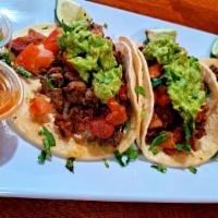 3  Taco Loco · Your choice of corn or flour tortilla.
Steak (asada) chorizo (sausage) and bacon topped with...