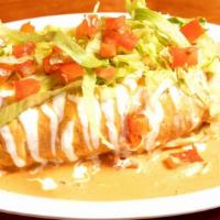 Steak Burrito Ahogado · Flour, tortilla loaded with refried beans, rice and cheese topped with your choice of sauce ...