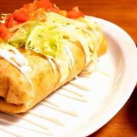 Vegetables Chimichanga · flour tortillas loaded with refried beans, rice and cheese topped with lettuce tomatoes and ...