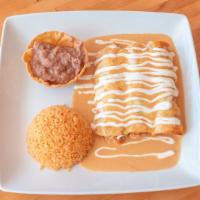 Cheese Enchiladas · Three stuffed corn tortillas, topped with melted mozzarella cheese, and sour cream. Served w...