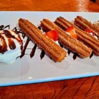 Churros · Fried dough pastry served with ice cream.