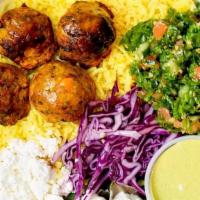 Falafel Tzatziki · organic falafel, kale tabbouleh with cucumber and tomato, purple cabbage, local feta, mint, ...