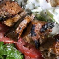 Seitan Souvlaki · Marinated and grilled seitan skewer served with fresh lettuce, tomatoes, and housmade tzatzi...