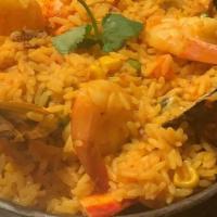 Paella De Mariscos · Seafood rice w/ shrimp, lobster, clams, mussels and calamari.

Consuming raw or undercooked ...