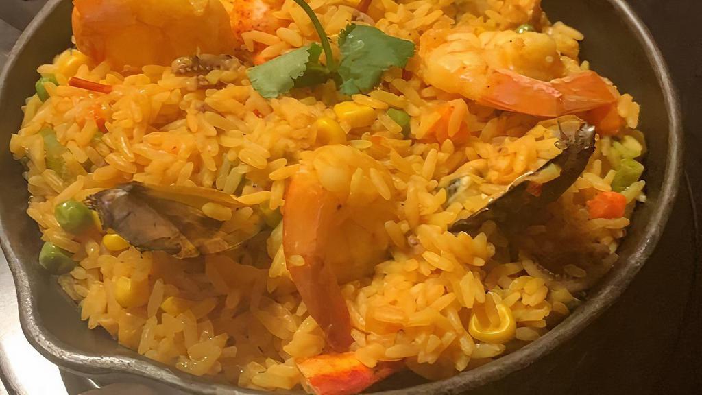 Paella De Mariscos · Seafood rice w/ shrimp, lobster, clams, mussels and calamari.

Consuming raw or undercooked meats, poultry, seafood, shellfish and eggs may increase your risk of foodborne illness.