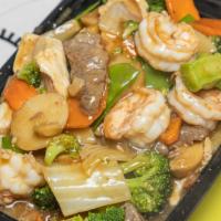South Shore Treasure · Tender chicken coupled with tender steer beef, and shrimps, roast pork, expertly sautéed wit...