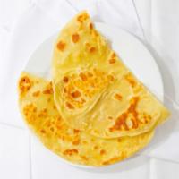 Paratha · Buttered pan baked all purpose wheat flatbread.